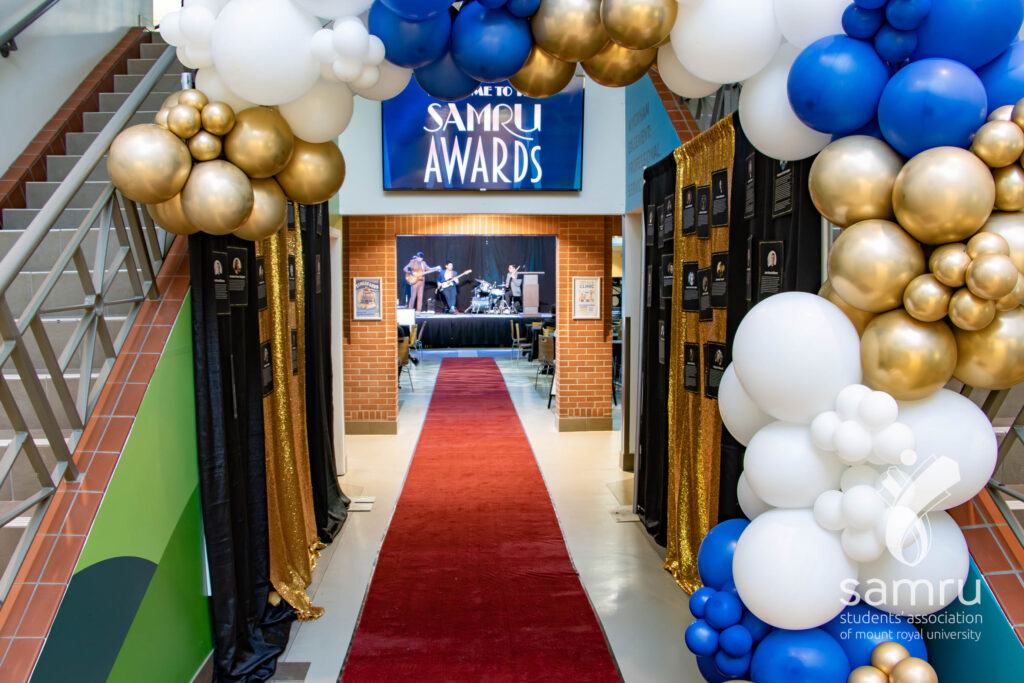 SAMRU Awards entrance. A balloon arch opens onto shimmering curtains that lead into Wyckham House